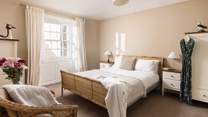 This comfy room has light flooding in.