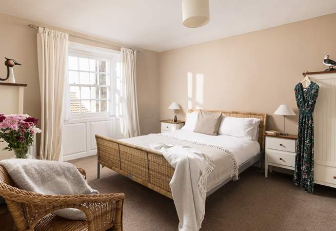 This comfy room has light flooding in.