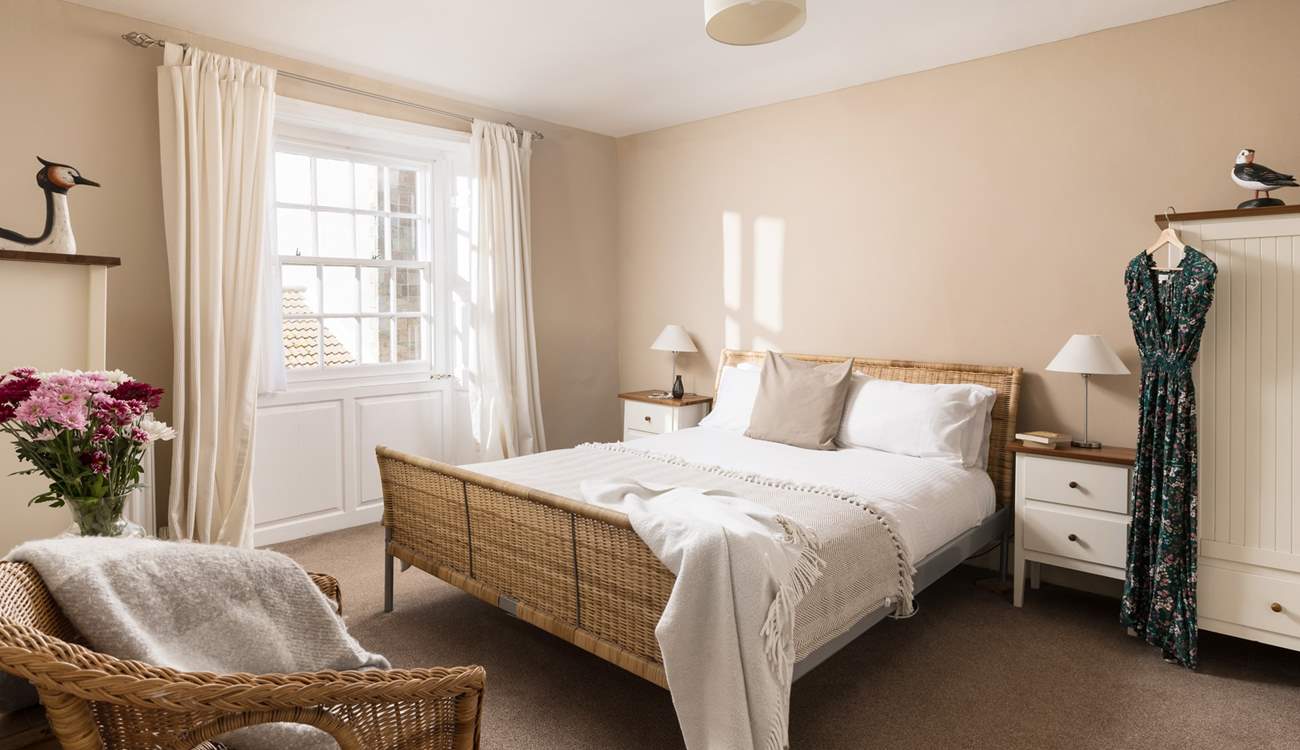 This comfy room has light flooding in.