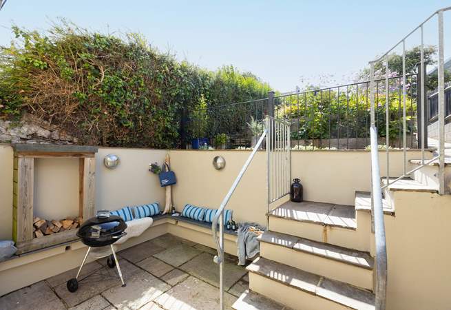Open the bi-fold doors and step out to the lower courtyard.