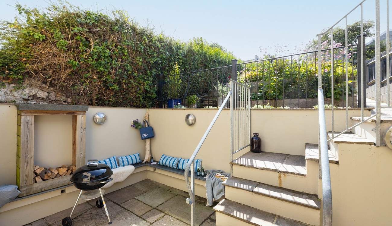 Open the bi-fold doors and step out to the lower courtyard.