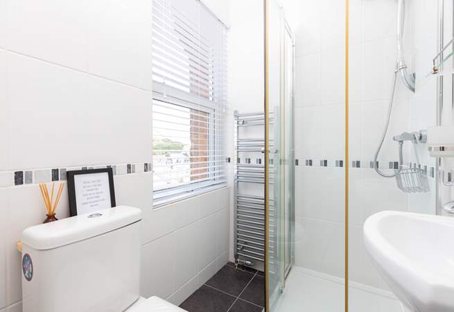 Bedroom 2 enjoys the benefit of a handy en suite shower.