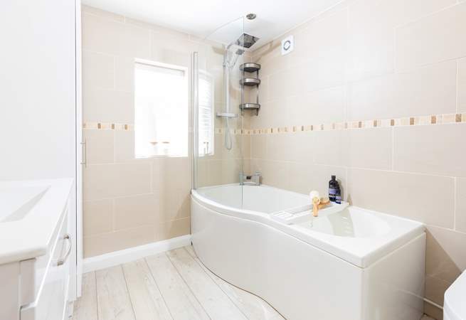 A generous family bathroom that sits on a half-landing before you head up to bedrooms 1 and 2.