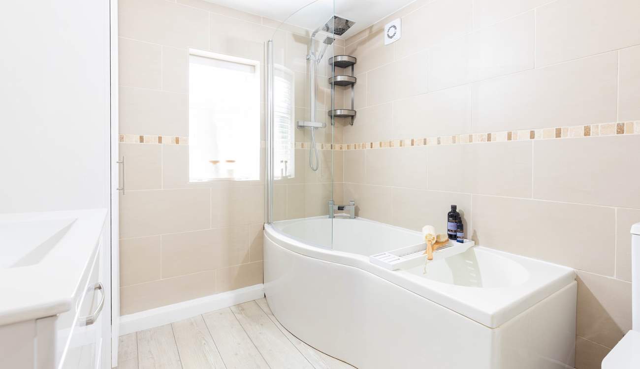 A generous family bathroom that sits on a half-landing before you head up to bedrooms 1 and 2.