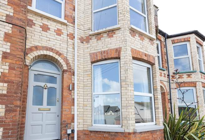 No 12 sits on a terraced street, climb the steps up to the front door.