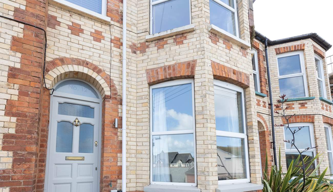 No 12 sits on a terraced street, climb the steps up to the front door.