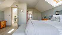 Relax in the light and airy main bedroom.
