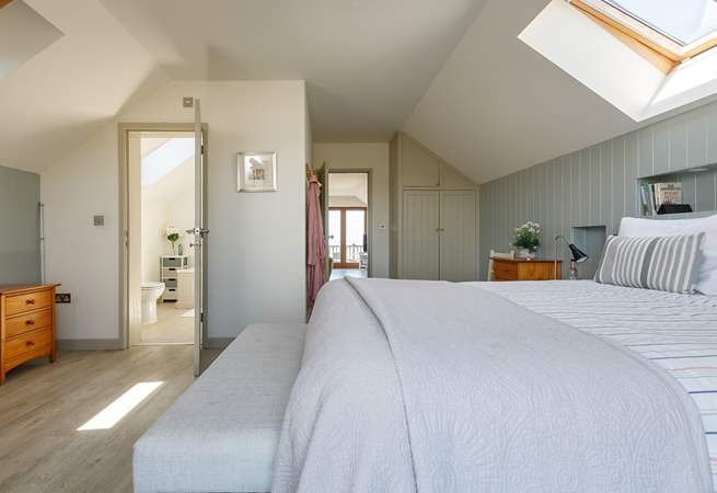 Relax in the light and airy main bedroom.