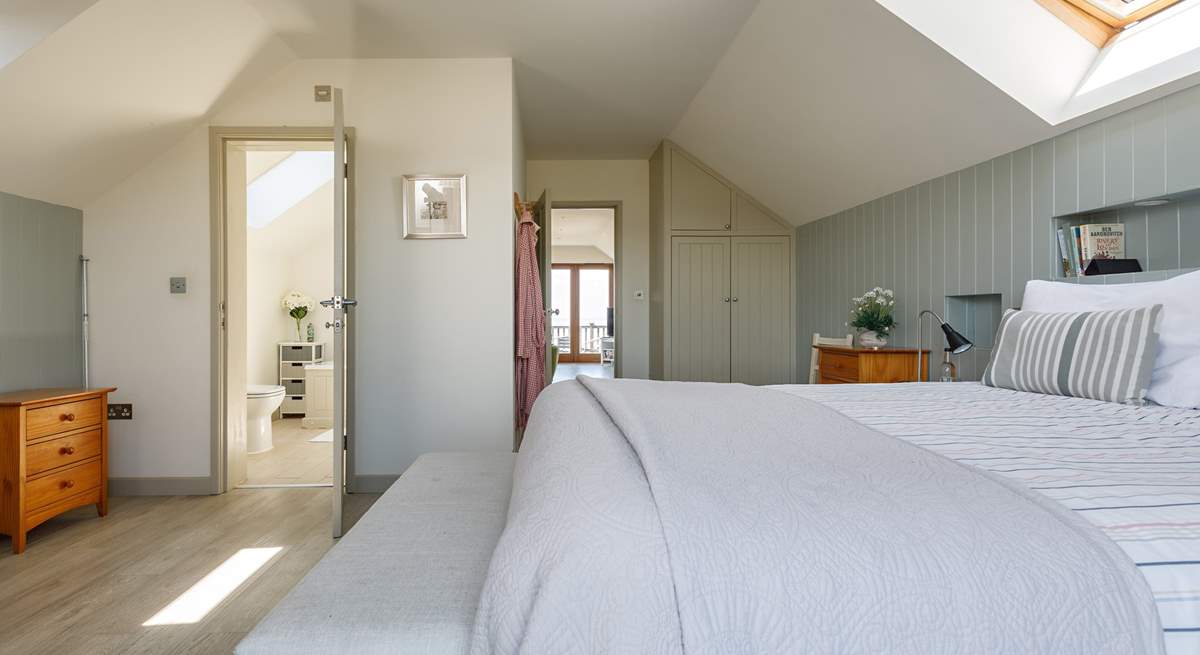 Relax in the light and airy main bedroom.