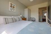 Enjoy a relaxing night's sleep in the sumptuous bed in the ground floor double bedroom.