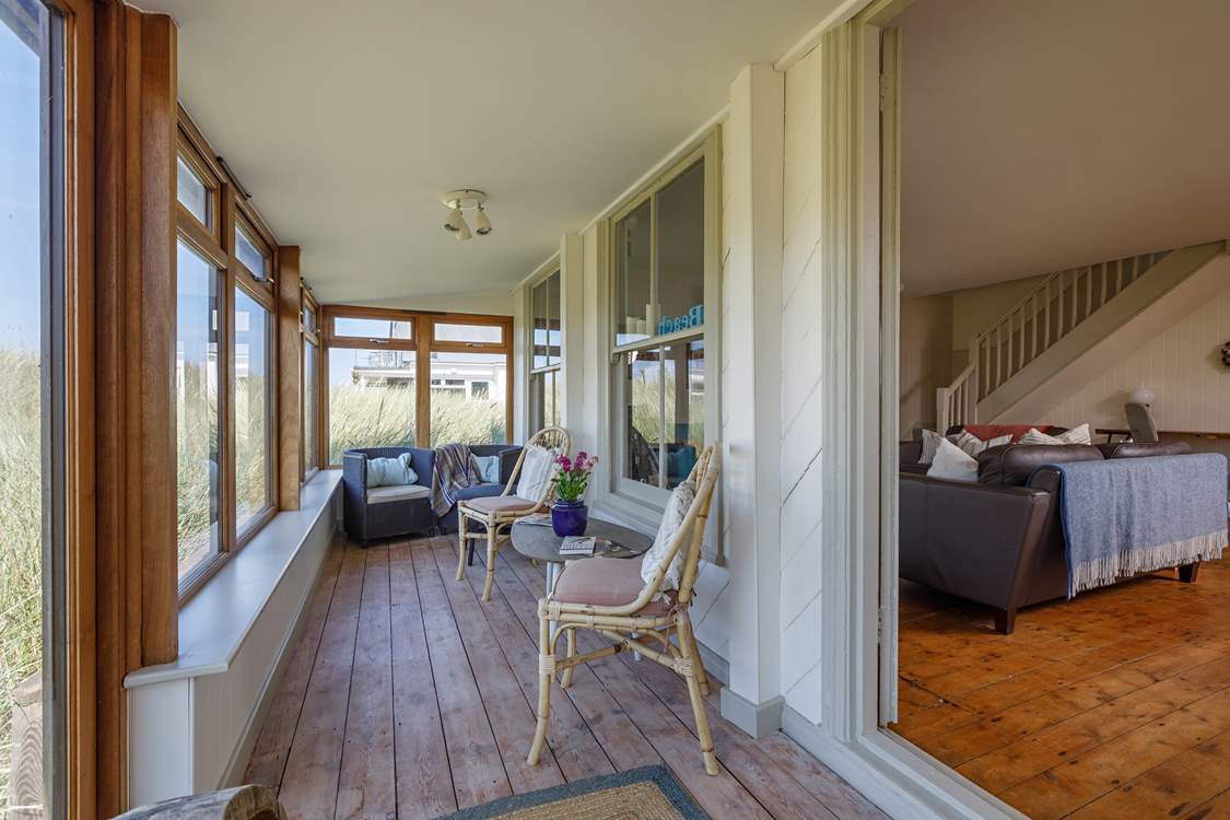A tranquil place to enjoy a novel with the soundtrack of the sea.