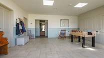 The entrance lobby/games-room has table football and a table-tennis table.