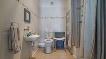 The lower ground floor wet-room has accessible shower facilities.