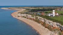 At low tide take a stroll along the promenade towards the lighthouse at 'Sunny Hunny'.
