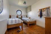 The ground floor twin bedroom is perfect for adults or children.