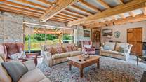 Retiring to the sitting-room at any time of the day is a pleasure, especially as it opens out onto the covered verandah.