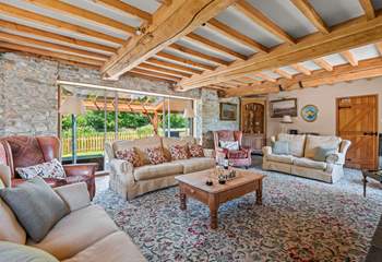 Retiring to the sitting-room at any time of the day is a pleasure, especially as it opens out onto the covered verandah.