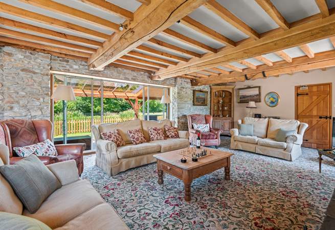Retiring to the sitting-room at any time of the day is a pleasure, especially as it opens out onto the covered verandah.