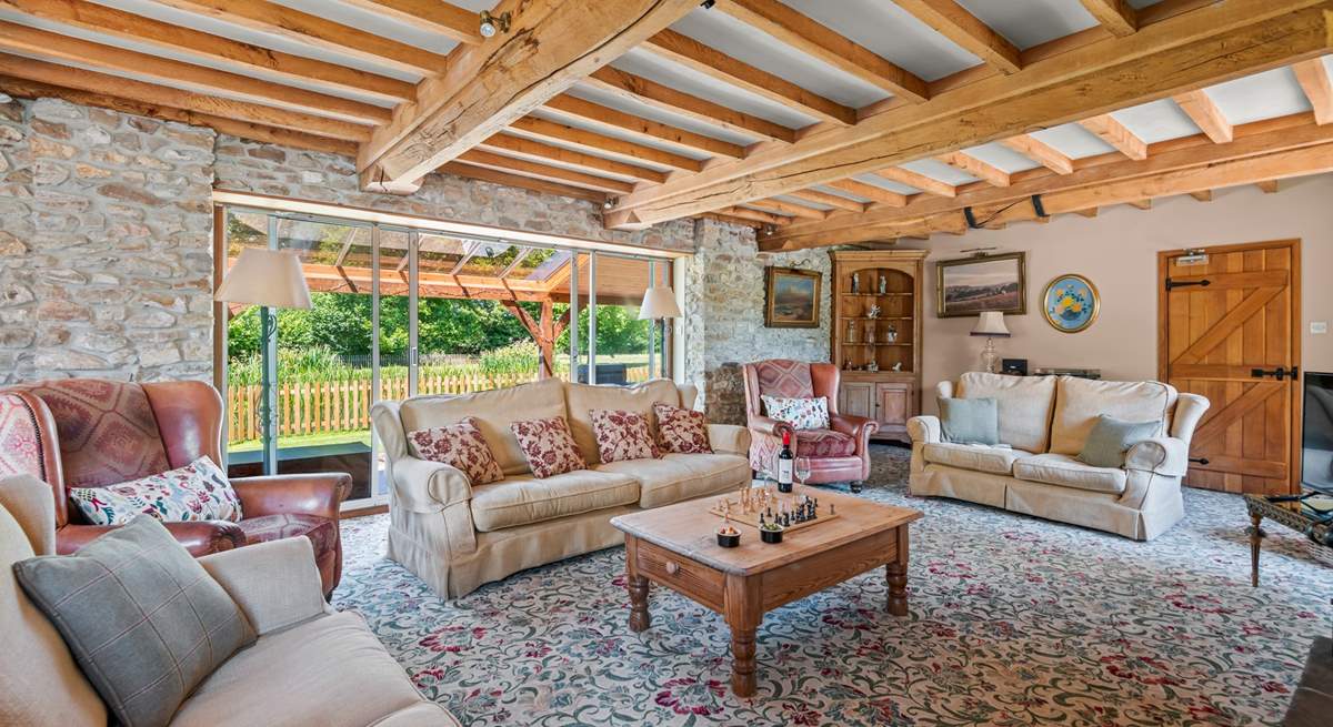 Retiring to the sitting-room at any time of the day is a pleasure, especially as it opens out onto the covered verandah.