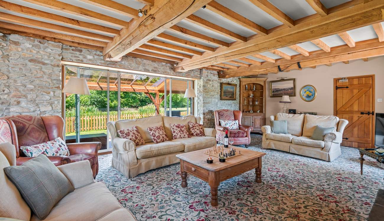 Retiring to the sitting-room at any time of the day is a pleasure, especially as it opens out onto the covered verandah.