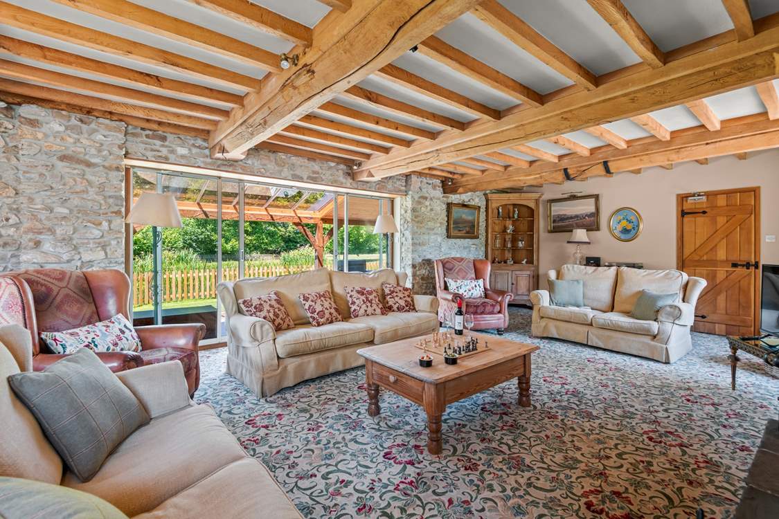 Retiring to the sitting-room at any time of the day is a pleasure, especially as it opens out onto the covered verandah.
