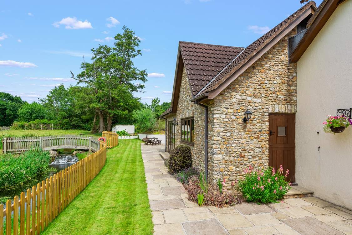 The external areas offer something for everyone. Another seating area can be enjoyed at the furthest end of the patio.