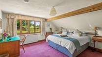 Bedroom 5 is super inviting and offers a super-king bed, which can also be configured as a twin on request, as well as an en suite shower-room.