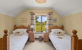 Bedroom 2 is home to this cute twin room. Boasting beautiful countryside views too. - Thumbnail Image