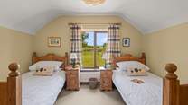 Bedroom 2 is home to this cute twin room. Boasting beautiful countryside views too.