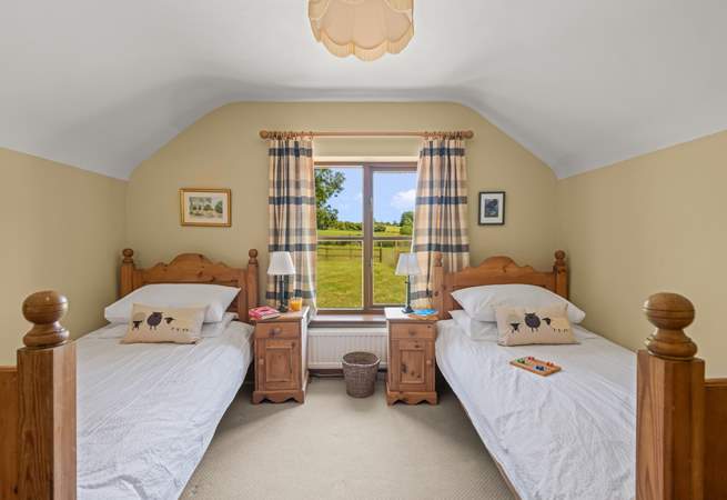 Bedroom 2 is home to this cute twin room. Boasting beautiful countryside views too.