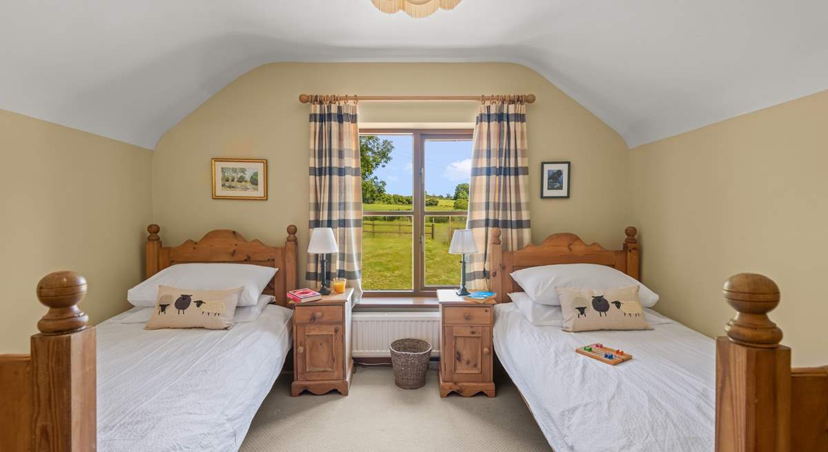 Bedroom 2 is home to this cute twin room. Boasting beautiful countryside views too.