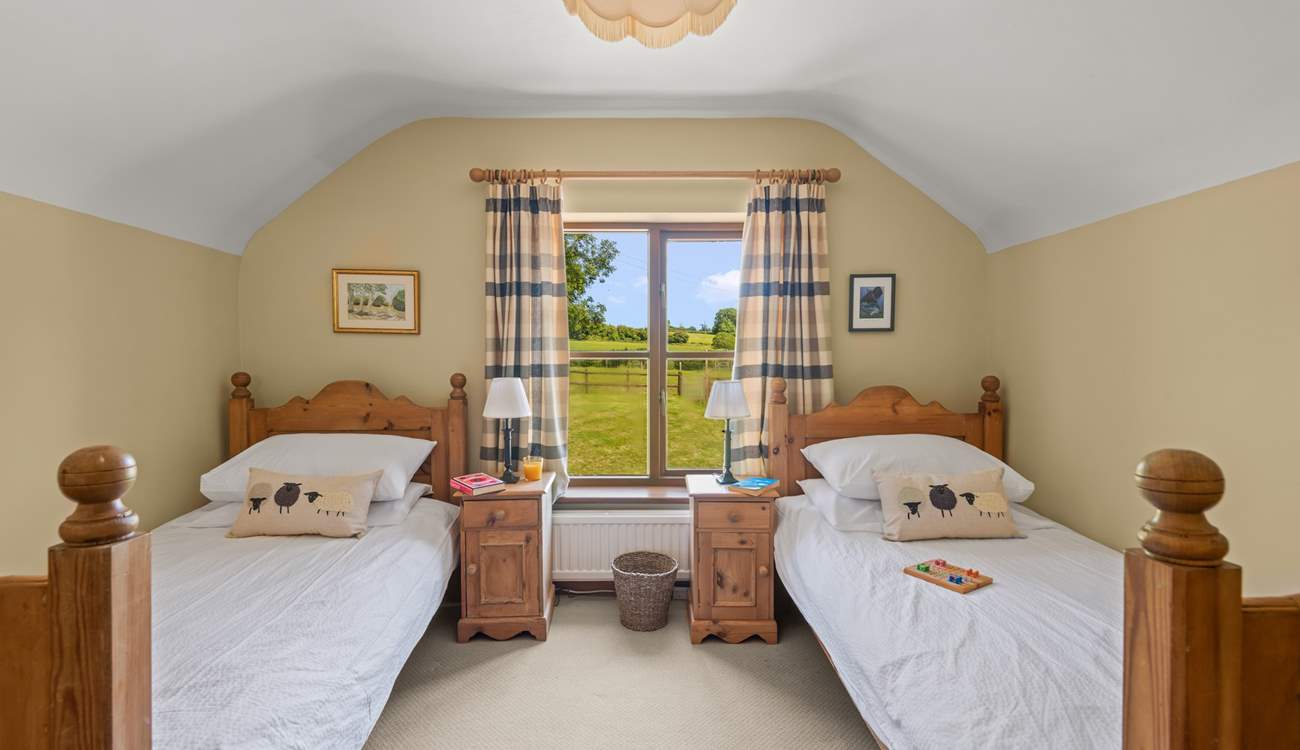 Bedroom 2 is home to this cute twin room. Boasting beautiful countryside views too.