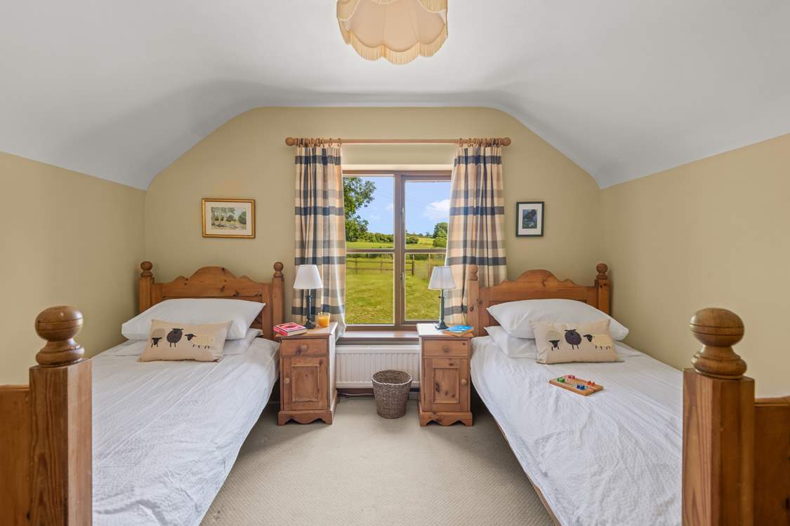 Bedroom 2 is home to this cute twin room. Boasting beautiful countryside views too.