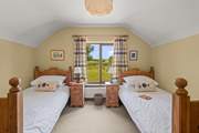 Bedroom 2 is home to this cute twin room. Boasting beautiful countryside views too.