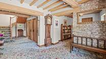 Back inside Lexhayne Mill, the stairs to the first floor bedrooms lead from the grand entrance hall.