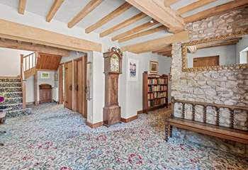 Back inside Lexhayne Mill, the stairs to the first floor bedrooms lead from the grand entrance hall.