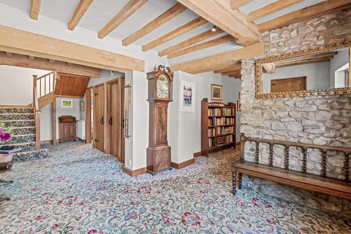 Back inside Lexhayne Mill, the stairs to the first floor bedrooms lead from the grand entrance hall.
