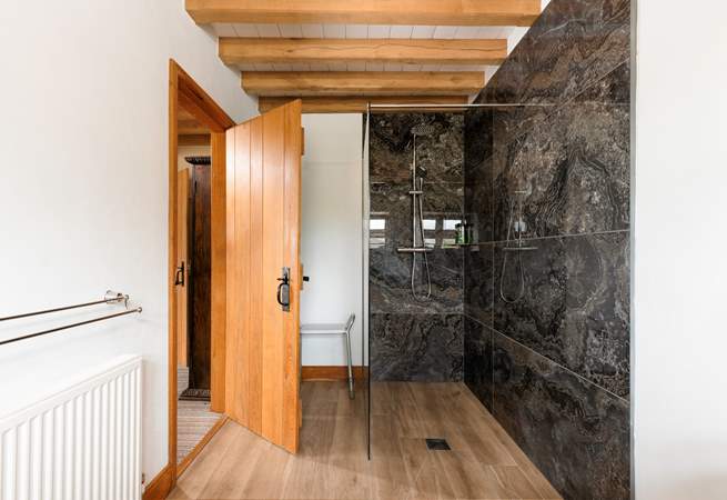 The spacious en suite shower-room is beautifully fitted out.