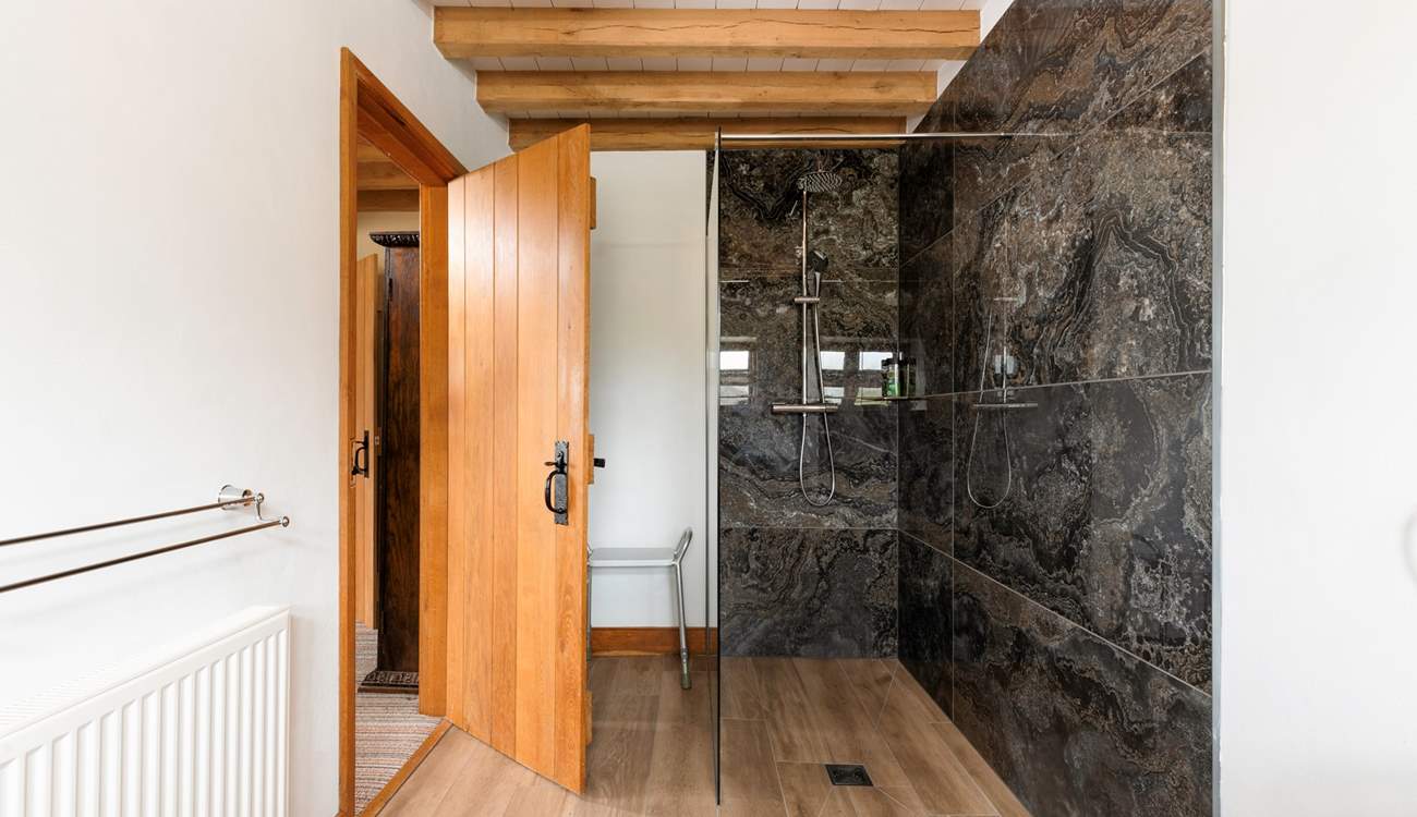 The spacious en suite shower-room is beautifully fitted out.