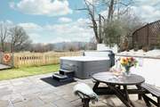 Enjoy your surroundings from the bubbling hot tub after a busy day of exploring - bliss!