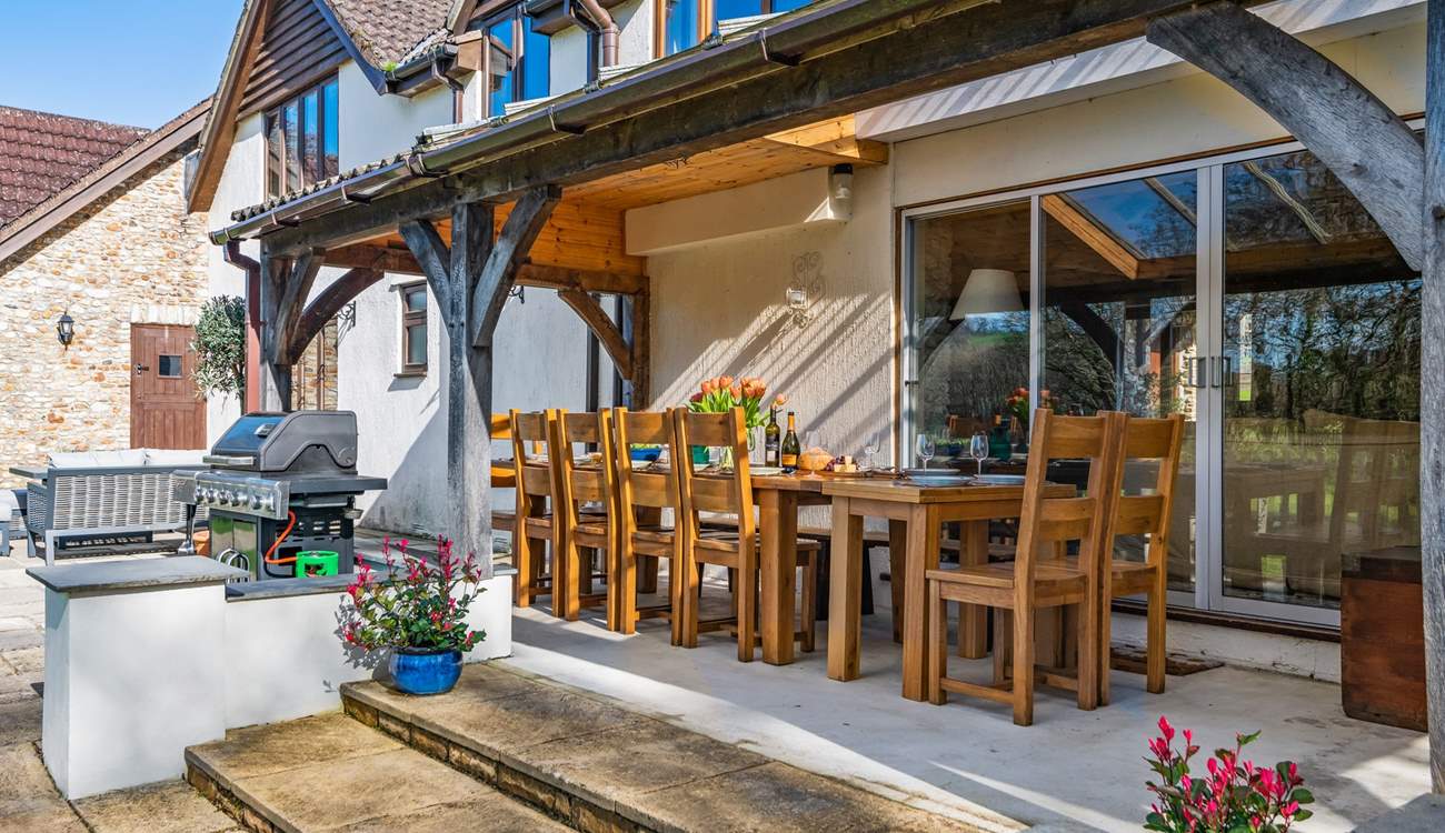 Step out of the sitting-room onto the covered verandah area.