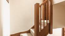 There is a winding staircase leading upstairs.