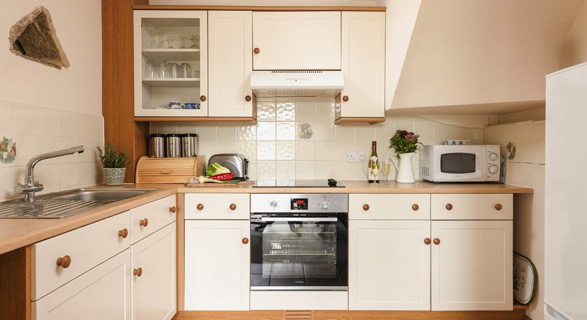 The cottage style kitchen is fully equipped for all your culinary needs.