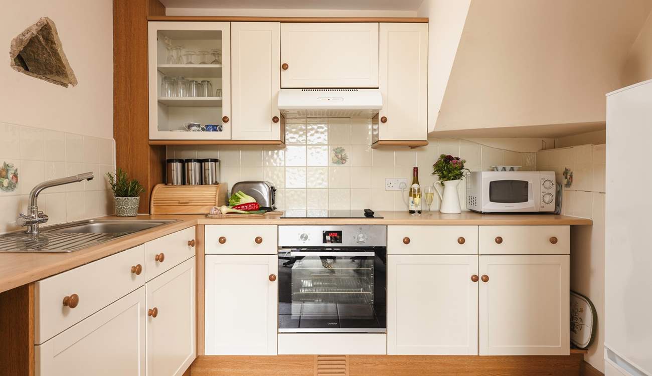 The cottage style kitchen is fully equipped for all your culinary needs.