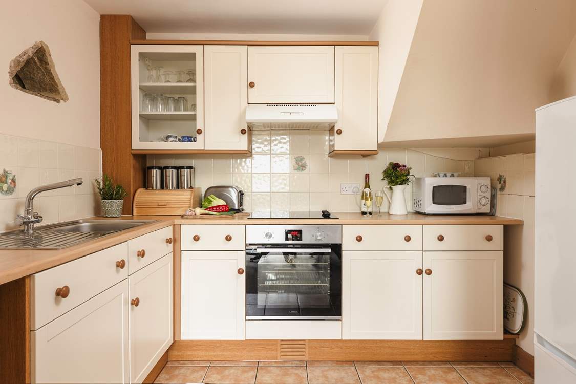 The cottage style kitchen is fully equipped for all your culinary needs.