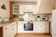 The cottage style kitchen is fully equipped for all your culinary needs.