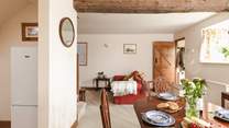 The open plan living and dining-area enjoys original features