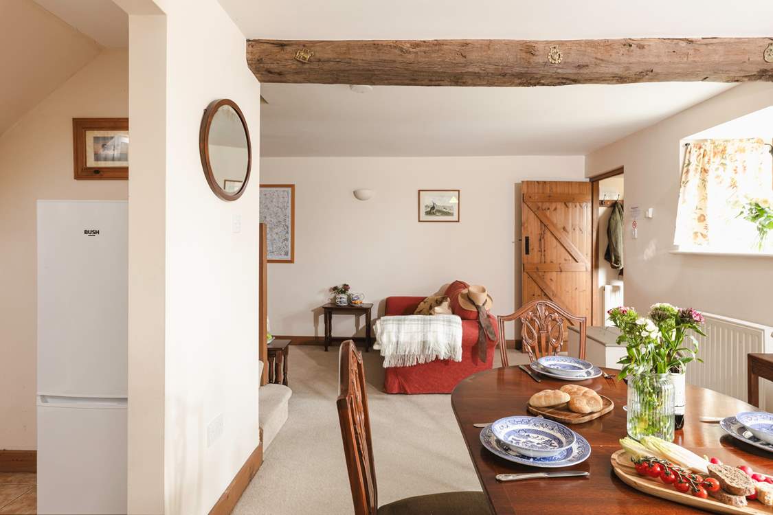 The open plan living and dining-area enjoys original features