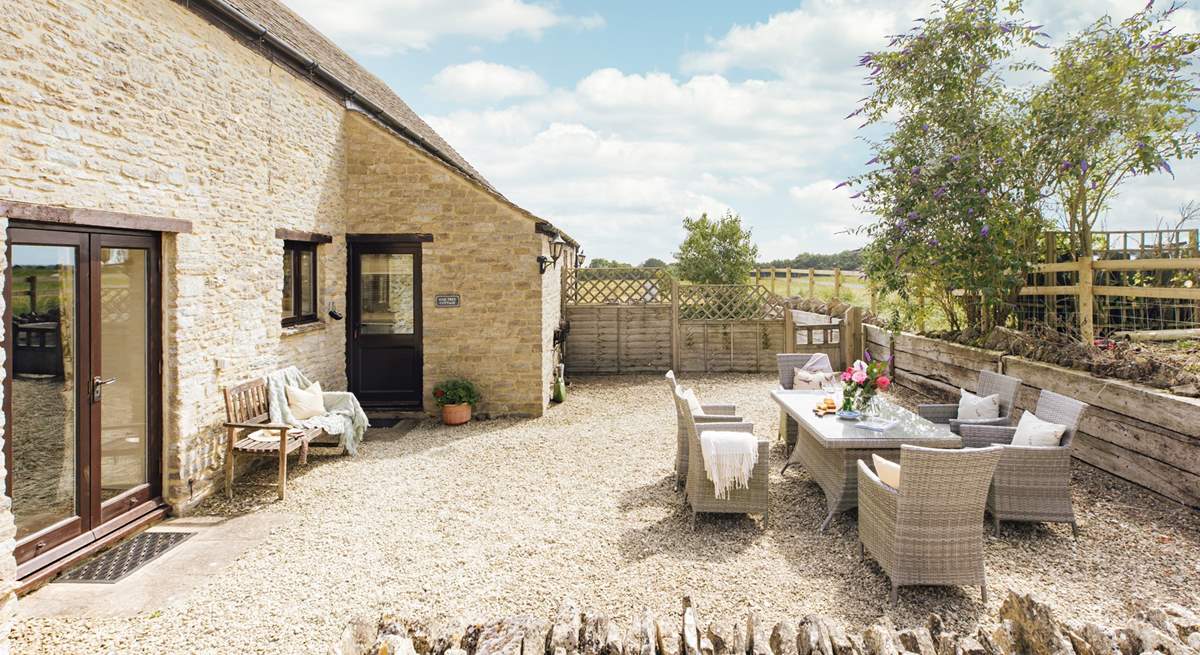 The pretty gravelled outside space is perfect for al fresco dining.