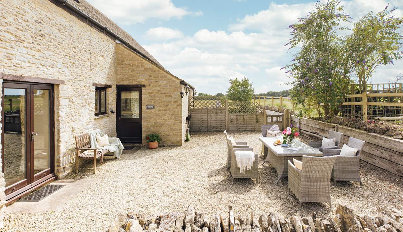 The pretty gravelled outside space is perfect for al fresco dining.